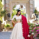 Badge and Red Lehenga